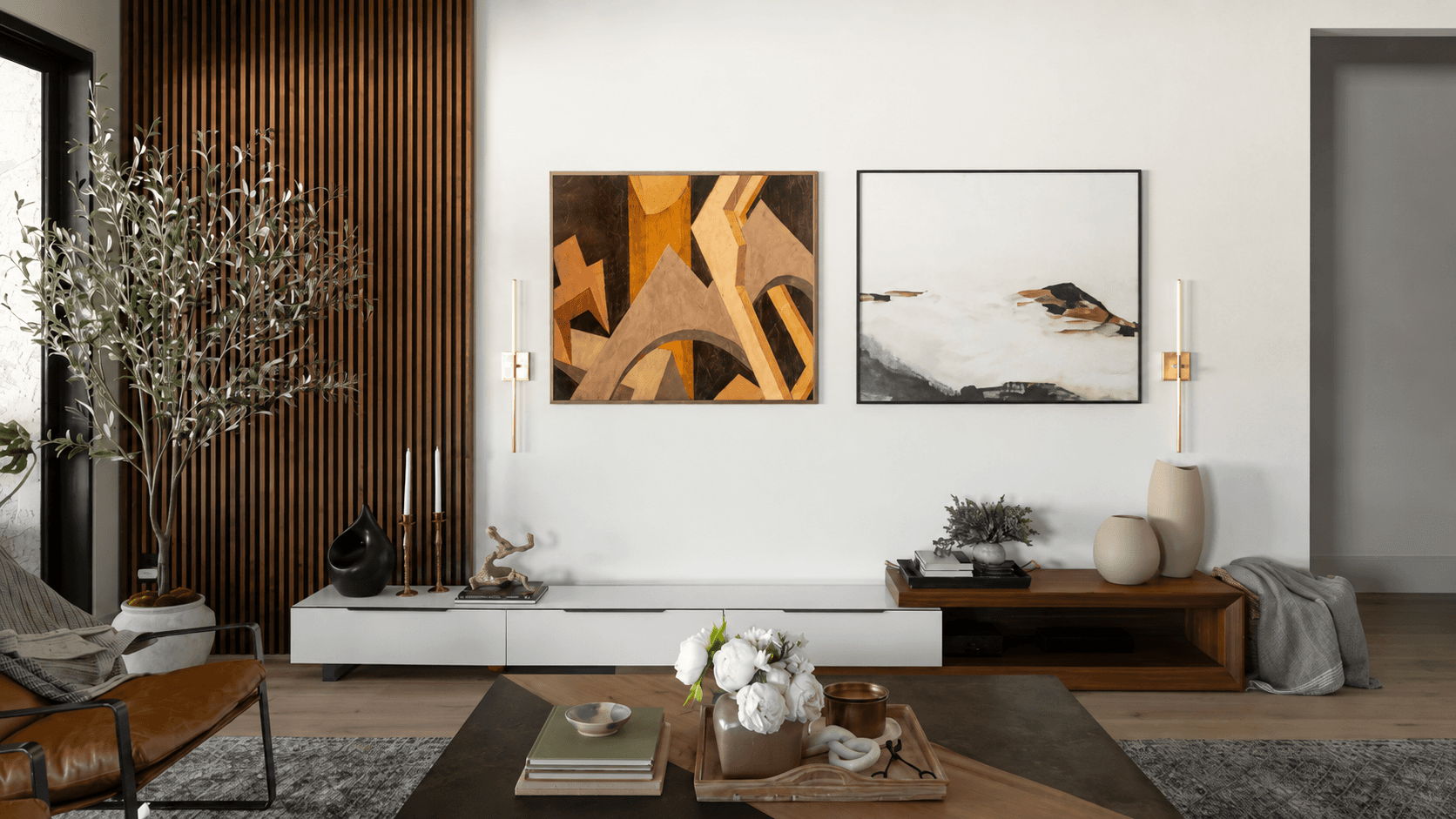 Original oil paintings displayed on a wall